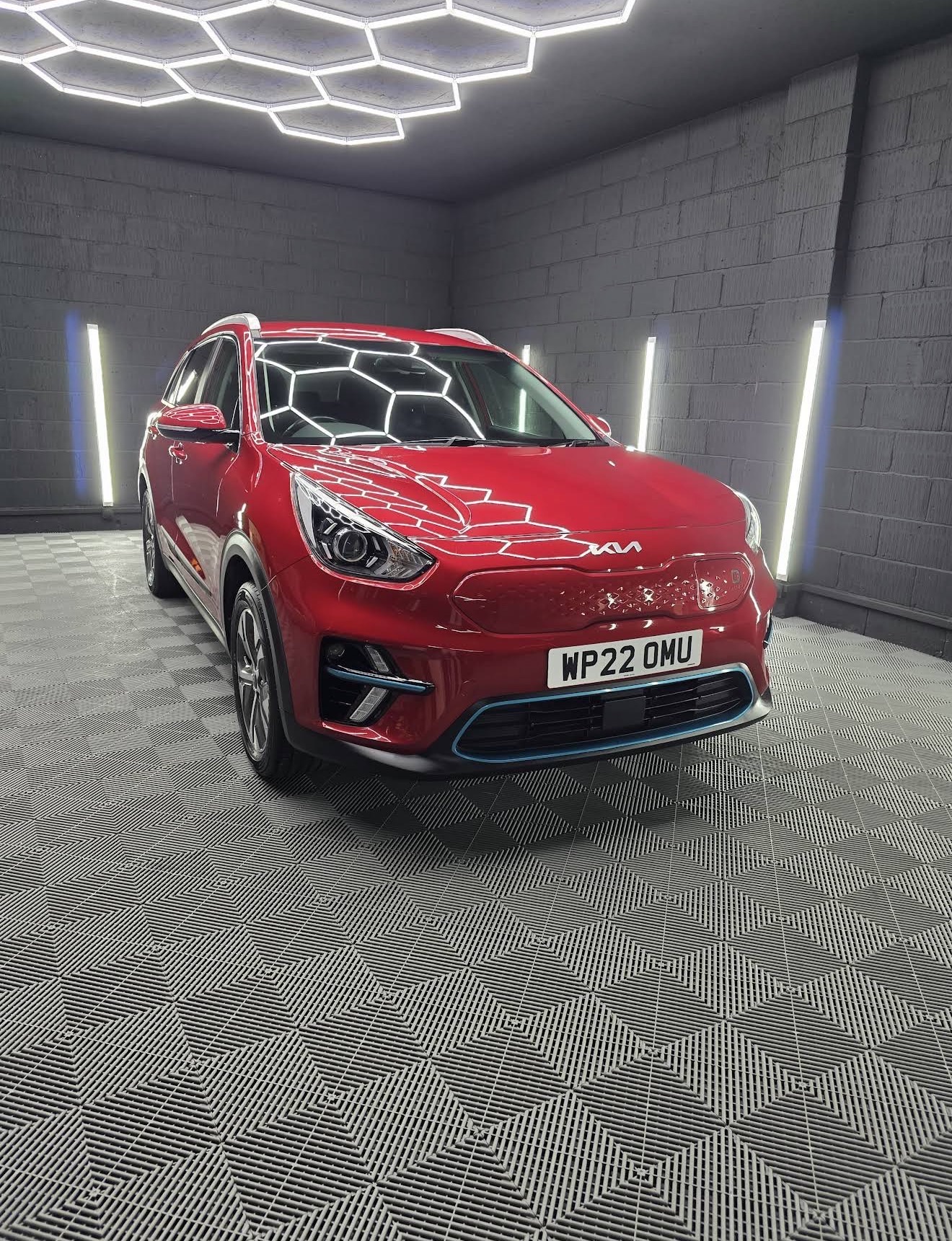 Red Kia Niro detailed front view