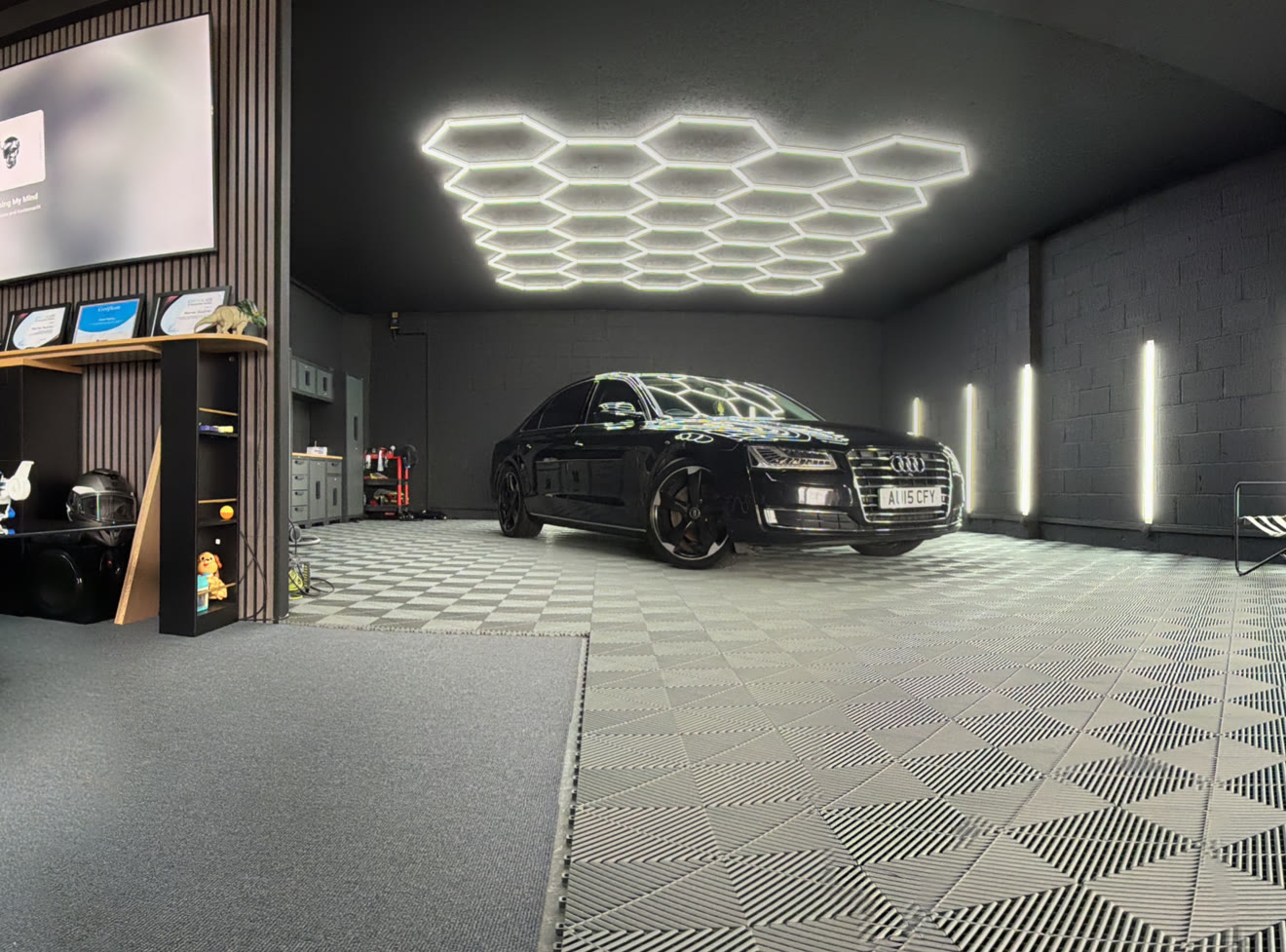M&M Detailing studio lounge with hexagon lighting and seating